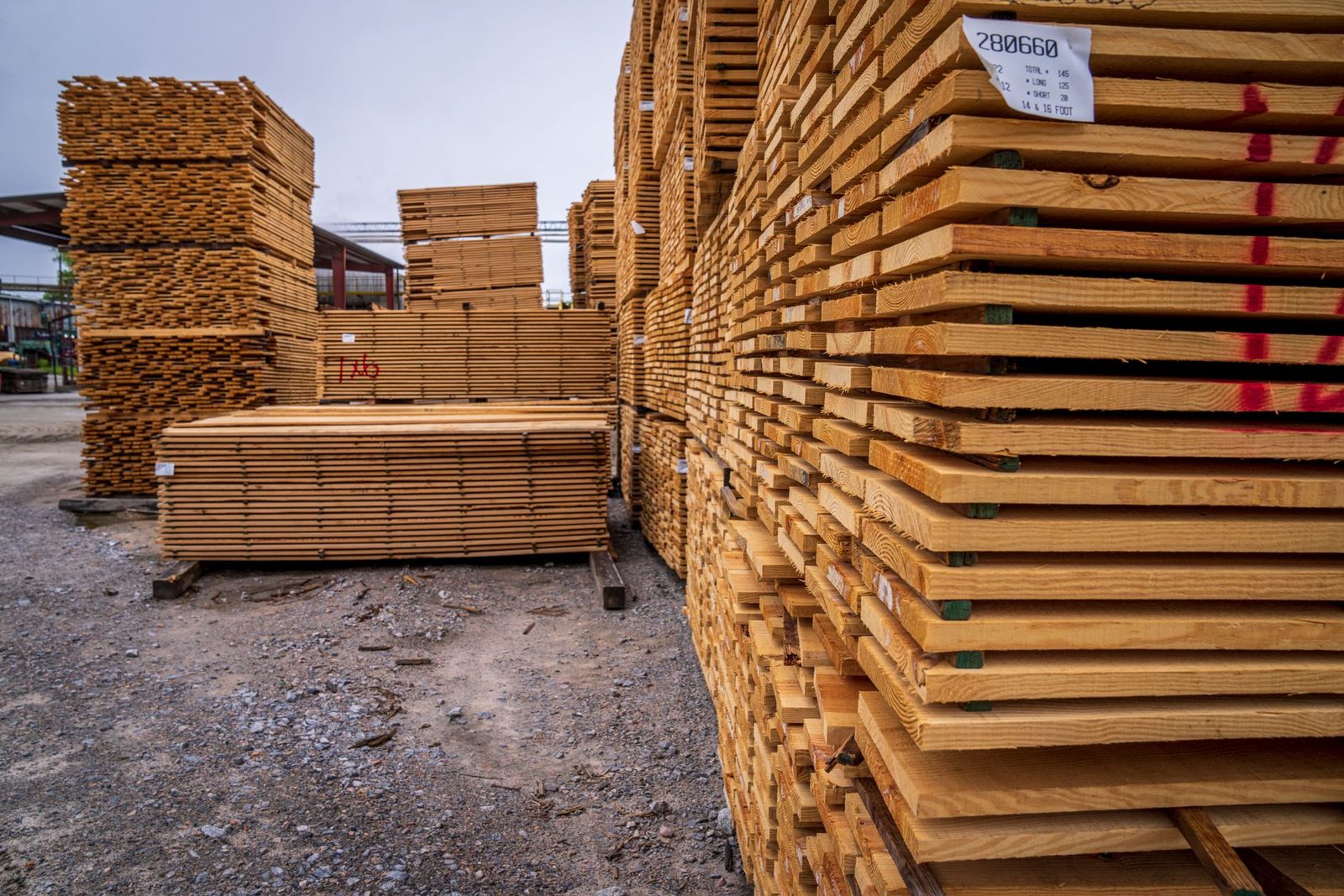 Sawn boards stacked with stickers between the courses